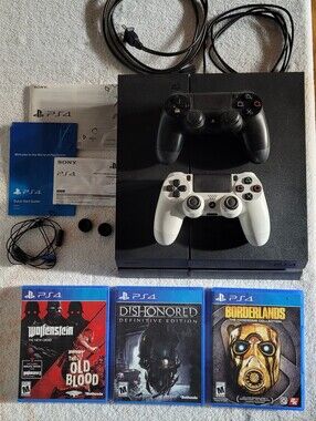 Sony PS4 Console with Black and White DualShock Controllers and Three Games